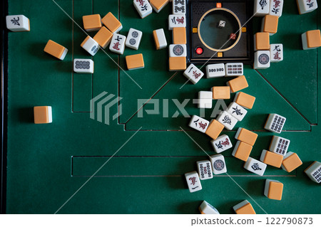 Mahjong tiles on an electric mahjong table (aerial view) Mahjong tiles on an electric mahjong table (aerial view) 122790873