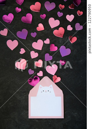 multicolored hearts on dark background and envelope 122790950