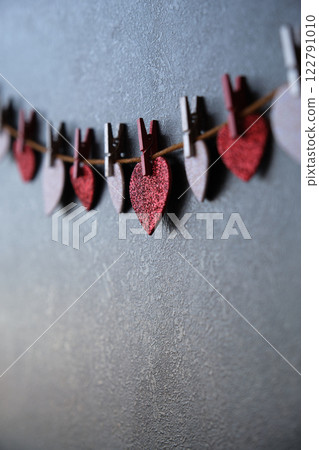 On a dark background on a string of hearts On a dark background on a string of hearts 122791010