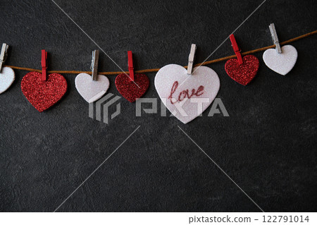 On the heart there is an inscription love next to other hearts 122791014
