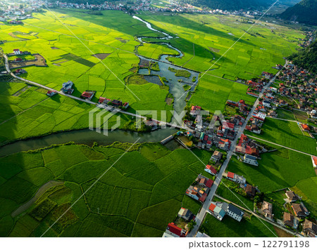 Aerial top view of Green rice field at northern vietnam,Beautiful destination in Northern Vietnam,Travel and landscape concept, Nature and rice fields background Aerial top view of Green rice field at northern vietnam,Beautiful destination in Northern Vietnam,Travel and landscape concept, Nature and rice fields background 122791198