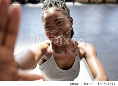 Fitness, happy and black woman taking a selfie in the gym after training, exercise and workout alone. Smile, healthy and young African woman influencer, wellness and active lifestyle on social media 122791233
