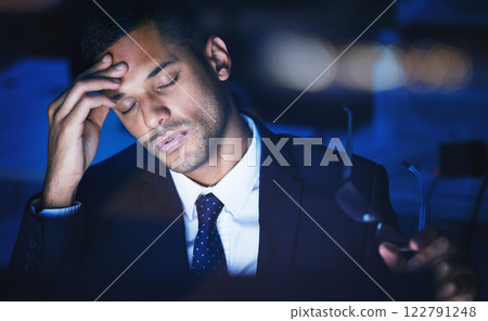 Night, stress and headache of a businessman working overtime or late in dark office for 404 report, IT coding or software deadline. Tired, frustrated or sad corporate information technology manager 122791248