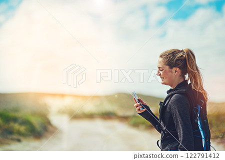 Fitness, phone and woman in nature space for training app, progress report and navigation. Athlete, mobile and tired on trail for exercise, catch breath and connection for location or communication 122791412