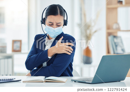 Call center, shoulder injury and woman at the office in pain holding arm in customer service. Business female in telemarketing suffering with muscle ache from work strain on laptop at the workplace. 122791424