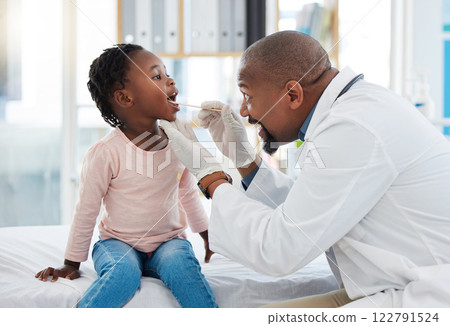 Doctor and child mouth or throat exam in healthcare hospital wellness room and medical consulting clinic. Medical expert or worker, employee and girl with trust and support for helping covid analysis Doctor and child mouth or throat exam in healthcare hospital wellness room and medical consulting clinic. Medical expert or worker, employee and girl with trust and support for helping covid analysis 122791524