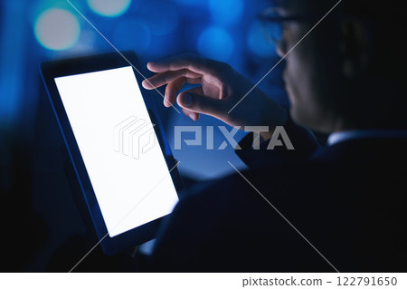 Tablet mock up, white screen and contact us website in a hand of a business man for advertising or digital marketing in a dark office at night. 5g wireless network with fast internet on mobile app 122791650