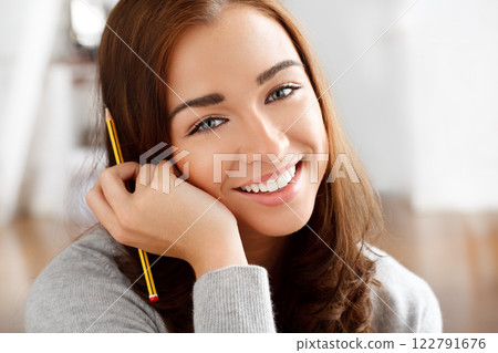 Education, young woman or student writing and working on university scholarship exam at home. Learning, motivation and study for college with a smile. Vision, design and a creative designer at school 122791676