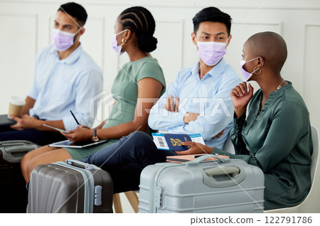 Covid, travel and compliance, men and women at airport with mask waiting for an airplane. Safety, security and diversity, a group of people, ticket and passport in hand and going on a business trip. 122791786