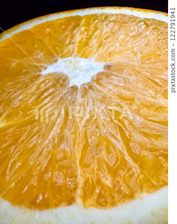Orange slice close-up, vibrant color, natural texture. High quality photo Orange slice close-up, vibrant color, natural texture. High quality photo 122791941