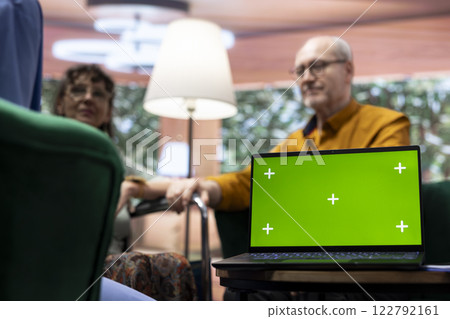 Medical assistant chatting with senior patients at home with isolated mockup display, offering advice and prescription medicine. Nurse discussing with old woman wheelchair user. 122792161