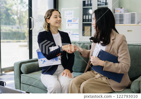 Business team creative are excited business success with inspiration from their excellent financial results that are happy working in a modern office on a computer. Business team creative are excited business success with inspiration from their excellent financial results that are happy working in a modern office on a computer. 122793010