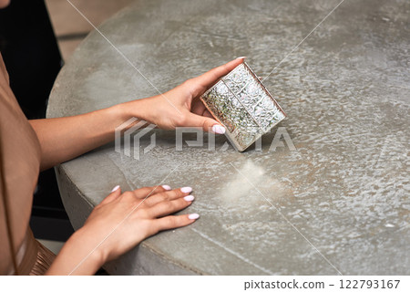Intricate Silver Box in Elegant Hands, Metallic Holder, Ornate Design, Woman's Handcrafted Accessory, Style Concept Intricate Silver Box in Elegant Hands, Metallic Holder, Ornate Design, Woman's Handcrafted Accessory, Style Concept 122793167