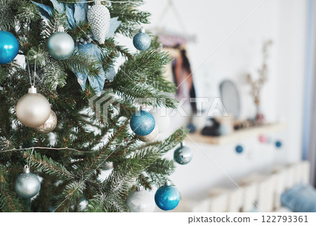 Close up of colorful ornaments on Christmas tree 122793361
