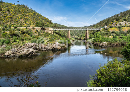 Walking along the Barca da Amieira walkways in Amieira do Tejo, Portugal. Walking along the Barca da Amieira walkways in Amieira do Tejo, Portugal. 122794058