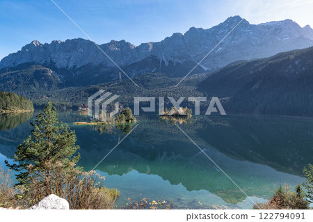 Autumn colors in fall at lake Eibsee, Garmisch-Partenkirchen, Bavarian alps, Germany Autumn colors in fall at lake Eibsee, Garmisch-Partenkirchen, Bavarian alps, Germany 122794091