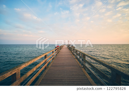 Jetty Pier at Kuehlungsborn, at the Baltic sea in Germany Jetty Pier at Kuehlungsborn, at the Baltic sea in Germany 122795826