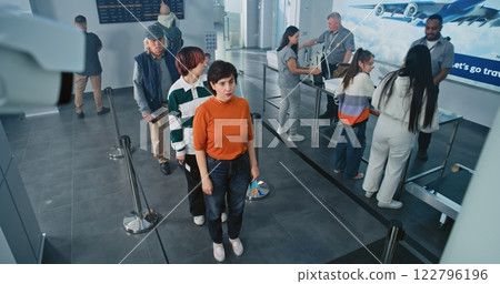 Queue of Diverse People on TSA Screening Procedures for Plane Flight. Rack Focus on CCTV Camera 122796196