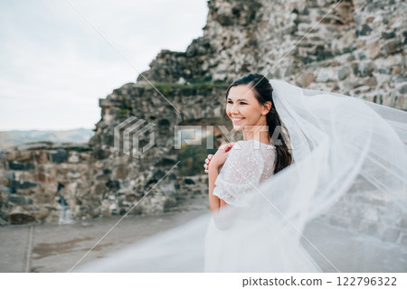 Stunning bride in a snow-white wedding dress with short sleeves. Stunning bride in a snow-white wedding dress with short sleeves. 122796322