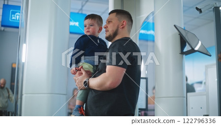 Security Officer Controls Passengers Screening Procedure for Flight Boarding, Uses Tablet Computer 122796336