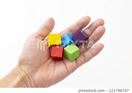 Hands holding colorful building blocks Hands holding colorful building blocks 122796787