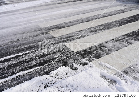 Frozen snow road and crosswalk Frozen snow road and crosswalk 122797106