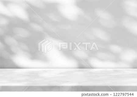 White Marble Table with Tree Shadow in the Garden on Concrete Wall Texture Background 122797544