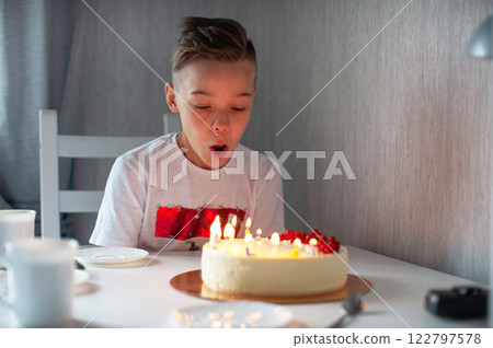 Happy Boy Celebrating Birthday with Cake 122797578