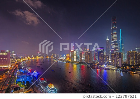 Night view of Shanghai skyline over Huangpu River with colorful reflections 122797621