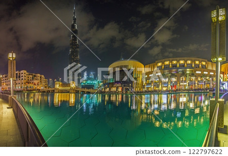 Burj Khalifa and Dubai Fountain at night with reflections in the water 122797622