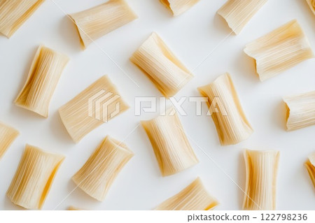 Rigatoni pasta on white surface with top-down view. Neural network AI generated Rigatoni pasta on white surface with top-down view. Neural network AI generated 122798236