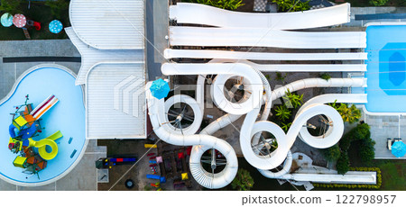 Aerial view of a water park with thrilling twisting slides, pools, and family-friendly attractions 122798957