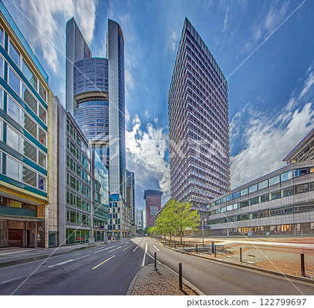 Modern architecture in Frankfurt with skyscrapers and urban streets under a blue sky 122799697