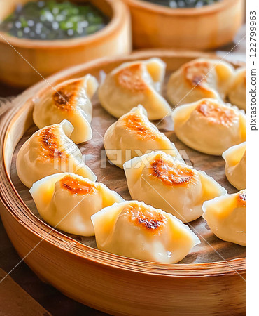 Steamed dumplings with butter served on a plate Steamed dumplings with butter served on a plate 122799963