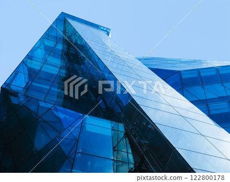 Modern building Glass facade Blue Reflection Architecture details  122800178