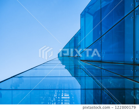 Modern building Glass facade Blue Reflection Architecture details Modern building Glass facade Blue Reflection Architecture details 122800179