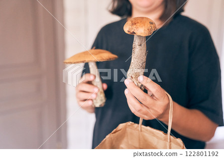 Mushroom picking by season. Edible and delicious wild mushroom for cooking. To hold the redheads in their raw form in your hands. High quality photo Mushroom picking by season. Edible and delicious wild mushroom for cooking. To hold the redheads in their raw form in your hands. High quality photo 122801192