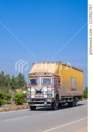 India_Colorful trucks running through the city 122802767