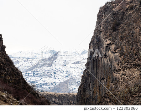view snowy mountains through Garni Gorge, Armenia 122802860