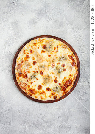 Freshly baked cheese pizza, white pizza, on a wooden plate, homemade, no people, 122803062