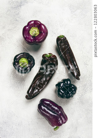 Assortment of purple and black pepper , scattered on the table, top view, no people, 122803063