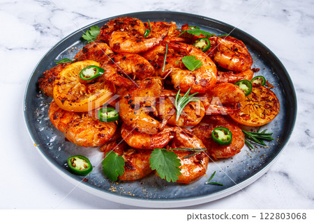 grilled shrimp, unpeeled, headless, with spices, on a marble table, homemade, no people, 122803068