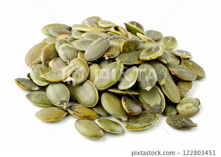 Heap of green pumpkin seeds isolated on white background 122803451