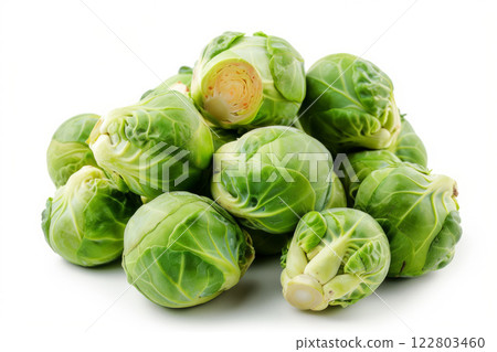 Fresh green Brussels sprouts piled on a white background. 122803460