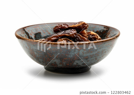 Bowl with dried dates on white background. Dates for Ramadan. 122803462