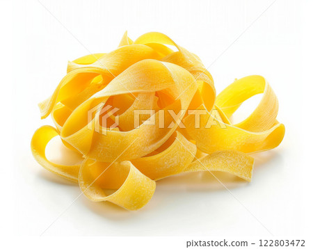 Fresh, uncooked tagliatelle pasta on a white background. Fresh, uncooked tagliatelle pasta on a white background. 122803472
