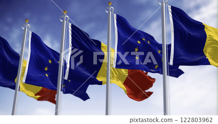 Romania and European Union flags waving in the wind on a clear day 122803962