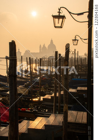 A mesmerizing Venetian landscape showcasing a mysterious, enchanting atmosphere A mesmerizing Venetian landscape showcasing a mysterious, enchanting atmosphere 122804168