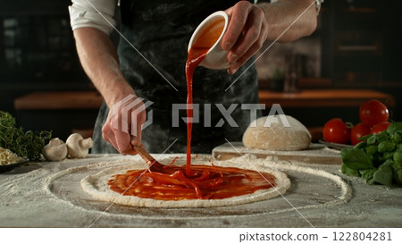 Closeup of Chef Making Pizza in Restaurant . Closeup of Pizza Preparation 122804281