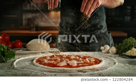 Closeup of Chef Making Pizza in Restaurant . Closeup of Pizza Preparation 122804284